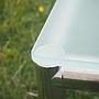 Coffee table with glass top and chromed aluminium base