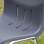 Stackable chair with anthracite polypropylene shell and tubular steel legs