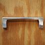 Cabinet handle in cast aluminium