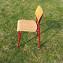 Chair in beech plywood and powder-coated steel legs by Presikhaaf