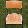 Stackable school chair in beech plywood and black steel legs