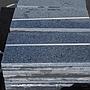 Batch of dark grey granite tiles with polished finish (± 8 m2)