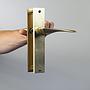 Door handle in gold-plated aluminium