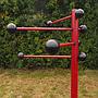 Coat rack in red coated bent steel
