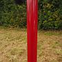 Coat rack in red coated bent steel