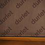 Armchair in brown synthetic leather by Durlet