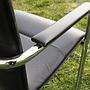 Cantilever armchair in steel and black synthetic leather