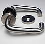Door handle in stainless steel with key rosettes