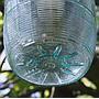 Outdoor industrial lantern with porcelain base and ribbed glass