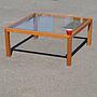 Square coffee table in laminated wood with glass table top