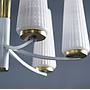 Chandelier in brass with textured glass shades