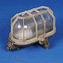 Caged wall/ceiling light with bakelite base and textured glass diffuser