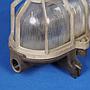 Caged wall/ceiling light with bakelite base and textured glass diffuser