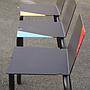 Black stackable chair by Pierre-Emmanuel Vandeputte (with various coloured corners)