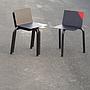 Black stackable chair by Pierre-Emmanuel Vandeputte (with various coloured corners)