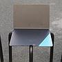Black stackable chair by Pierre-Emmanuel Vandeputte (with various coloured corners)