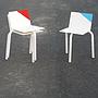 White stackable chair by Pierre-Emmanuel Vandeputte (with various coloured corners)