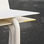 White stackable chair by Pierre-Emmanuel Vandeputte (with various coloured corners)