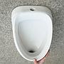 Wall mounted urinal in porcelain