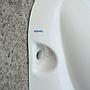 Wall mounted urinal in porcelain