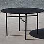 Round table with black wooden veneer top and steel legs