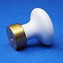 Cabinet knob in porcelain and brass base