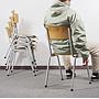 Stackable chair in plywood and lacquered steel