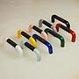 Colourful plastic cabinet handle with black rubber (ca. 1980)