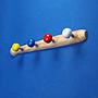 Coat hook 'Baseball' in pine with 4 painted nuts (L. 44 cm)