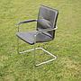 Cantilever armchair in steel and black synthetic leather