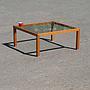 Square coffee table in laminated wood with glass table top
